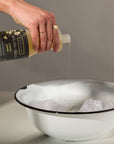 Eucalan Jasmine Delicate Wash - Model shown pouring product into bowl