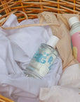 Kerzon Fragranced Mist – Petit Grain laying in a basket on linen