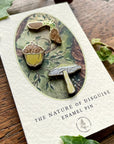 Georgiou Draws Woodland Seeds Mini Enamel Pin Badge Set - Product shown on wood table