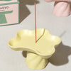 Octaevo Templo Incense Holder – Yellow - Product shown on counter with incense