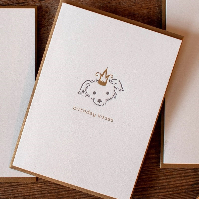 Oblation Papers & Press Birthday Kisses Adorable Animals Letterpress Card - Puppy - Overhead shot of product on wood table