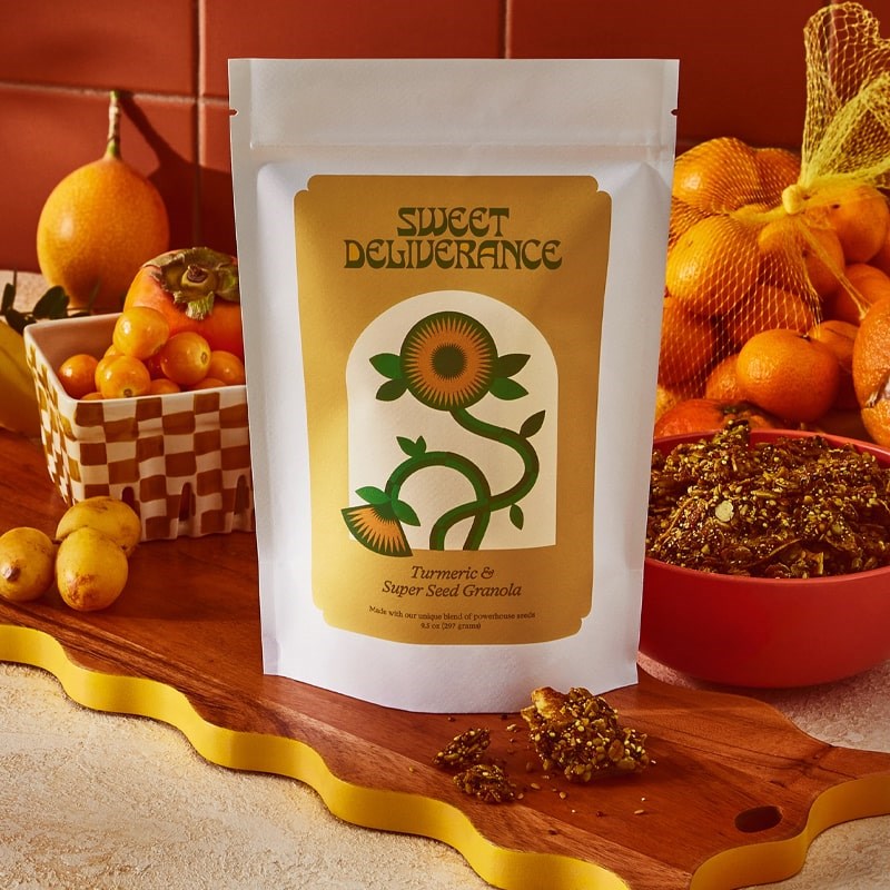 Sweet Deliverance Turmeric & Super Seed Granola - Product displayed on table