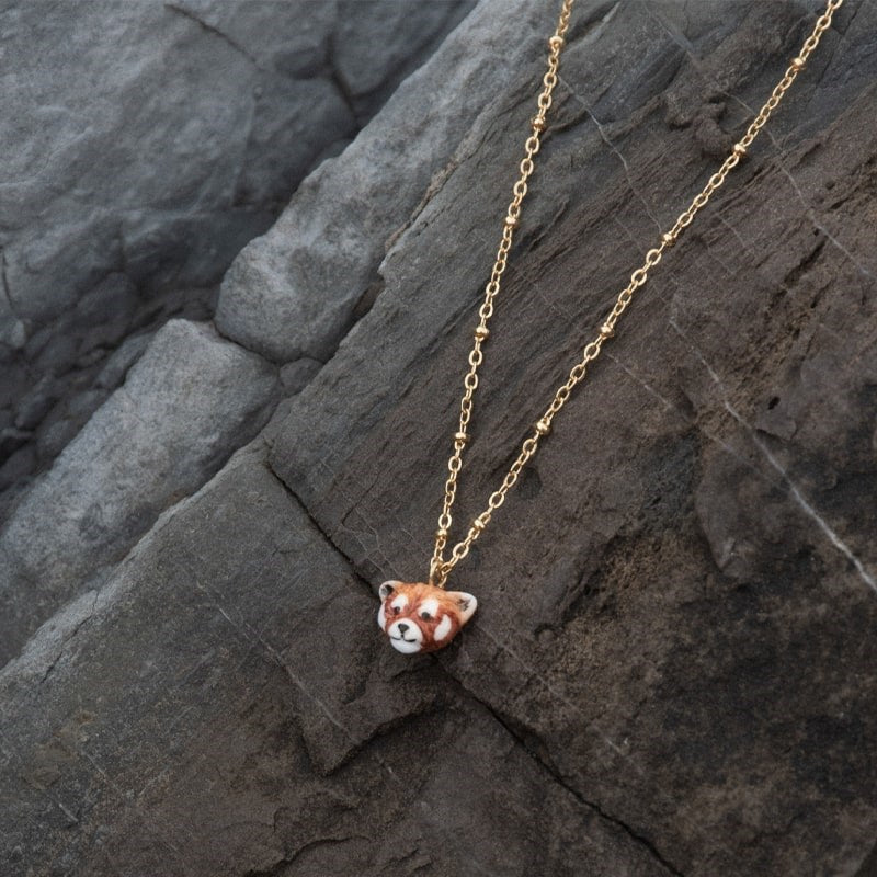 Nach Red Panda Mini Necklace - Product shown on rock background