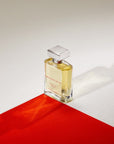 Ormonde Jayne Evernia Eau de Parfum - bottle on red fabric