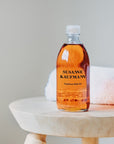 Susanne Kaufmann Hayflower Bath Oil - Product shown on stool