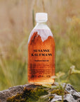 Susanne Kaufmann Hayflower Bath Oil - Beauty shot, product shown on rock