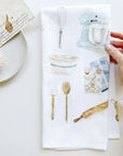 Emily Lex Studio Baking Tea Towel - photo of tea towel, models hand, plate, and letter on table