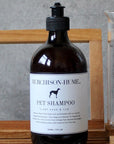 Murchison-Hume Organic Pet Shampoo - Clary Sage & Fur - Product shown on wood counter
