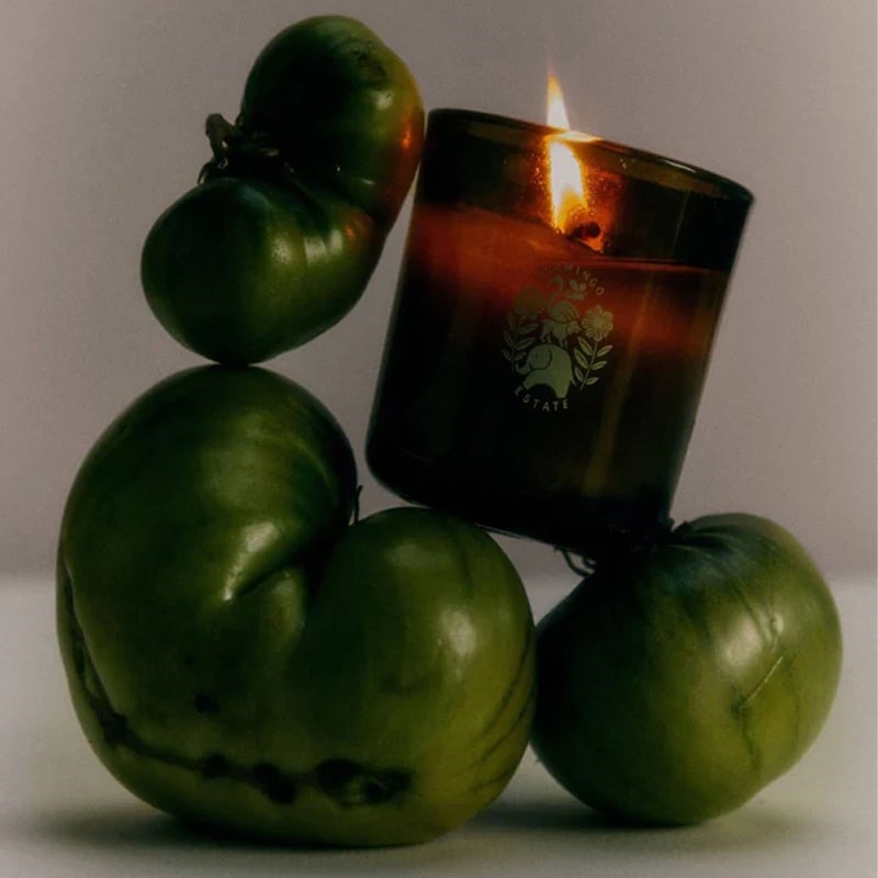 Flamingo Estate Organics Roma Heirloom Tomato Candle- Beauty shot, product shown stacked on top of tomatoes