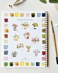 Emily Lex Studio Bouquets Watercolor Workbook - Product shown next to paint brush