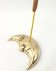FERN Brass Incense Holder Moon with Face - Product shown with incense