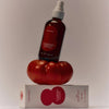 Flamingo Estate Organics Roma Heirloom Tomato Room Spray - room spray bottle on top of tomato and packaging