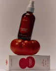 Flamingo Estate Organics Roma Heirloom Tomato Room Spray - room spray bottle on top of tomato and packaging