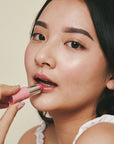 Pink House Organics Lip Tint - Rose - model using lip balm on lips