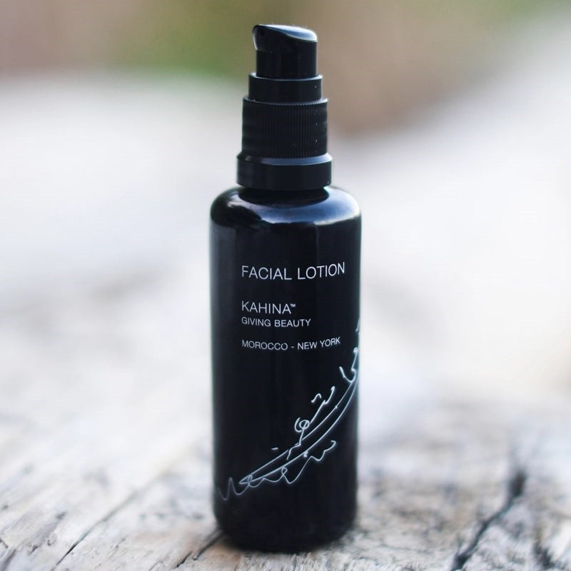 Kahina Giving Beauty Facial Lotion - Product shown on wooden surface