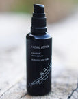 Kahina Giving Beauty Facial Lotion - Product shown on wooden surface