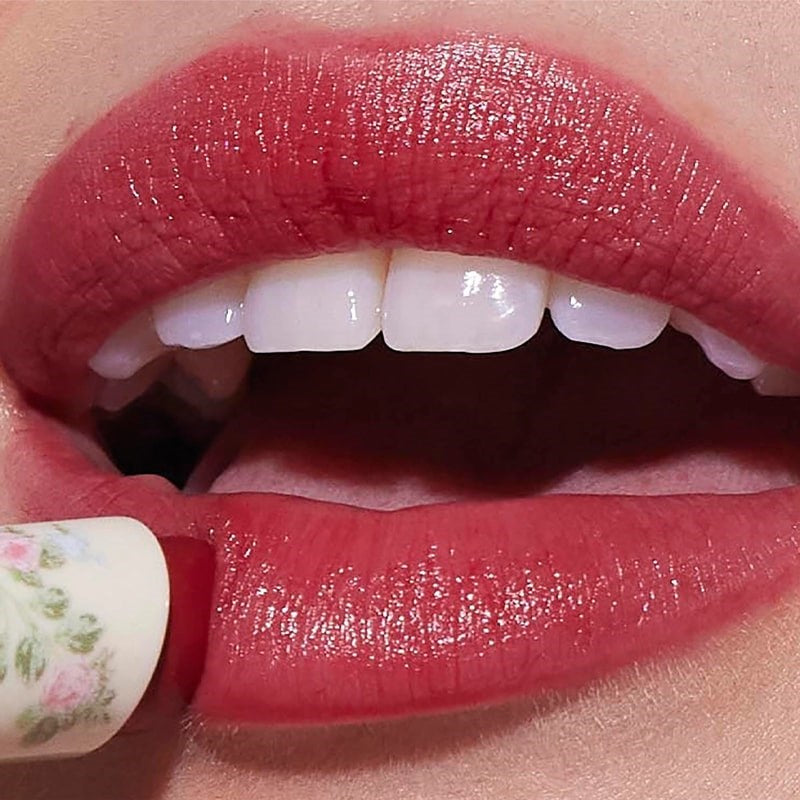 Yolaine Tinted Lip Balm - Bonbon - Closeup of model applying product