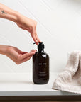 One Seed Probiome Hand & Body Wash - Wild Orange Green Tea - Model shown dispensing product into hand