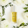 Leonor Greyl Serum Energisant - Energizing Serum for Thinning Hair - Beauty shot, product shown with flowers