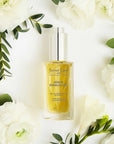 Leonor Greyl Serum Energisant - Energizing Serum for Thinning Hair - Beauty shot, product shown with flowers