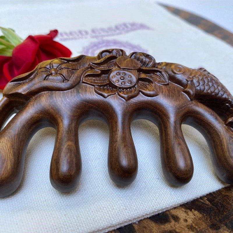 The Sacred Essence Gua Sha Sandalwood Comb - Closeup of product
