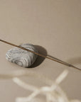 Looshi Vivacity Incense - one incense stick on top of rock